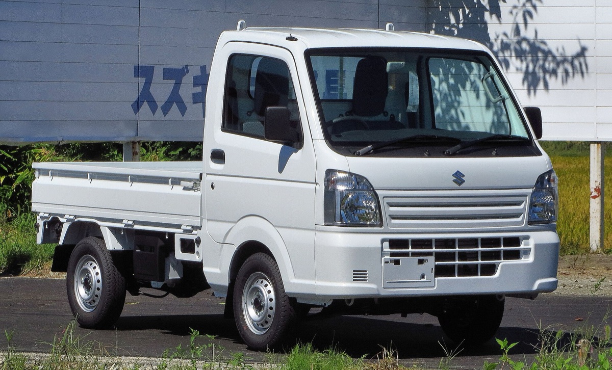 A current-generation Suzuki Carry Truck KC 4WD, the kind of modern kei truck that cannot be sold new in the United States despite meeting Japan's latest safety standards